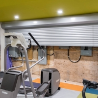 1_Basement-gym-with-metal-door-open-showing-electrical