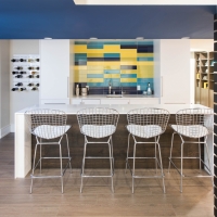 1_Basement-kitchen-with-fun-blue-and-yellow-backsplash-and-wine-rack