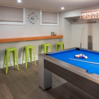 1_Basement-pool-table-with-green-and-orange-bar-seating