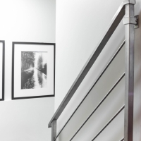 1_Basement-staircase-with-stainless-steel-railings-and-artwork