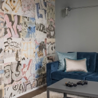 1_Basement-with-graffiti-wall-art-and-blue-couch-and-coffee-table