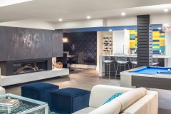 Basement-living-room-with-bar-and-pool-table-and-poker-area