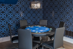 Basement-poker-table-with-blue-ceiling-and-patterned-wallpaper