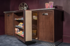 Basement-theatre-with-custom-popcorn-and-candy-station-with-hidden-storage